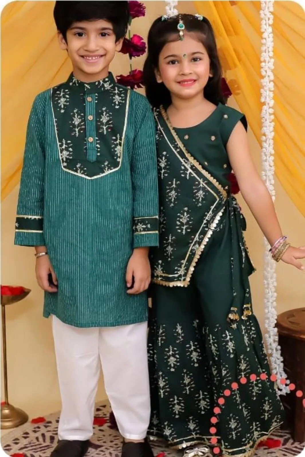 Siblings in green kurta and sharara, ready for a celebration